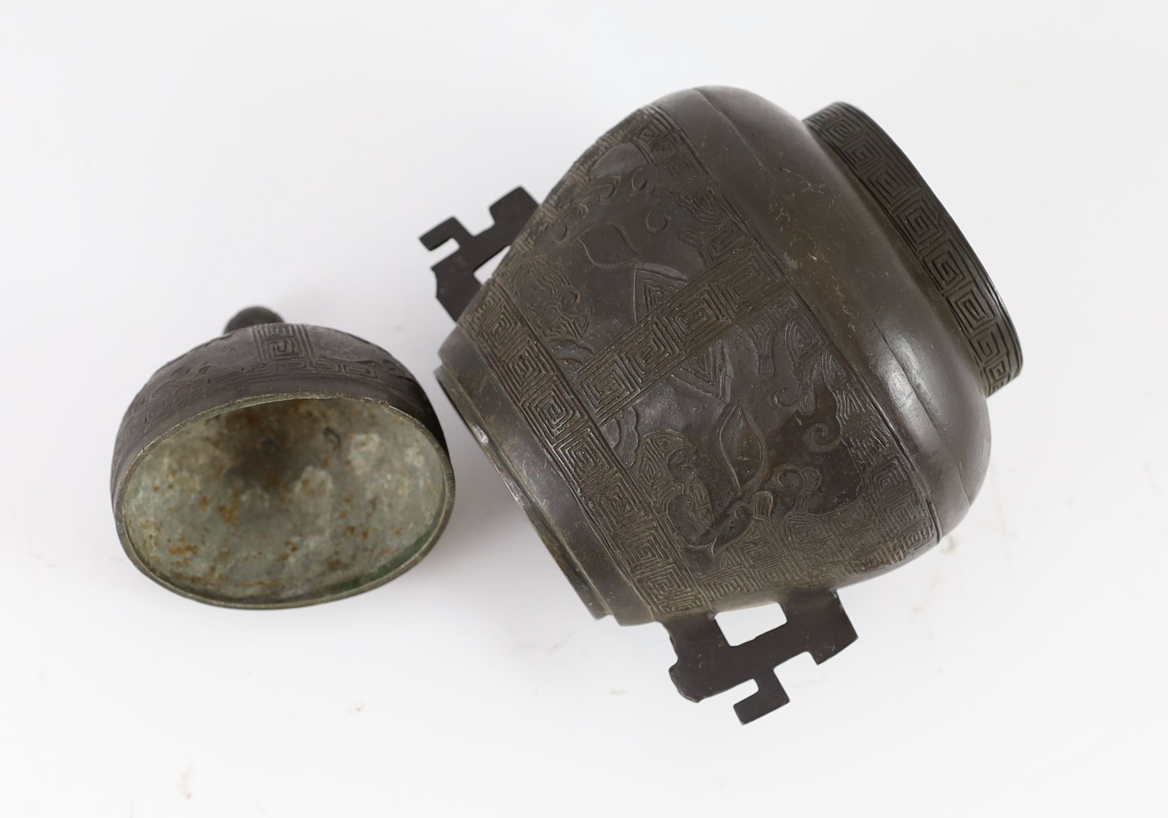 A Chinese bronze jar and cover, hu, 17th/18th century, 18cm high, losses to handles